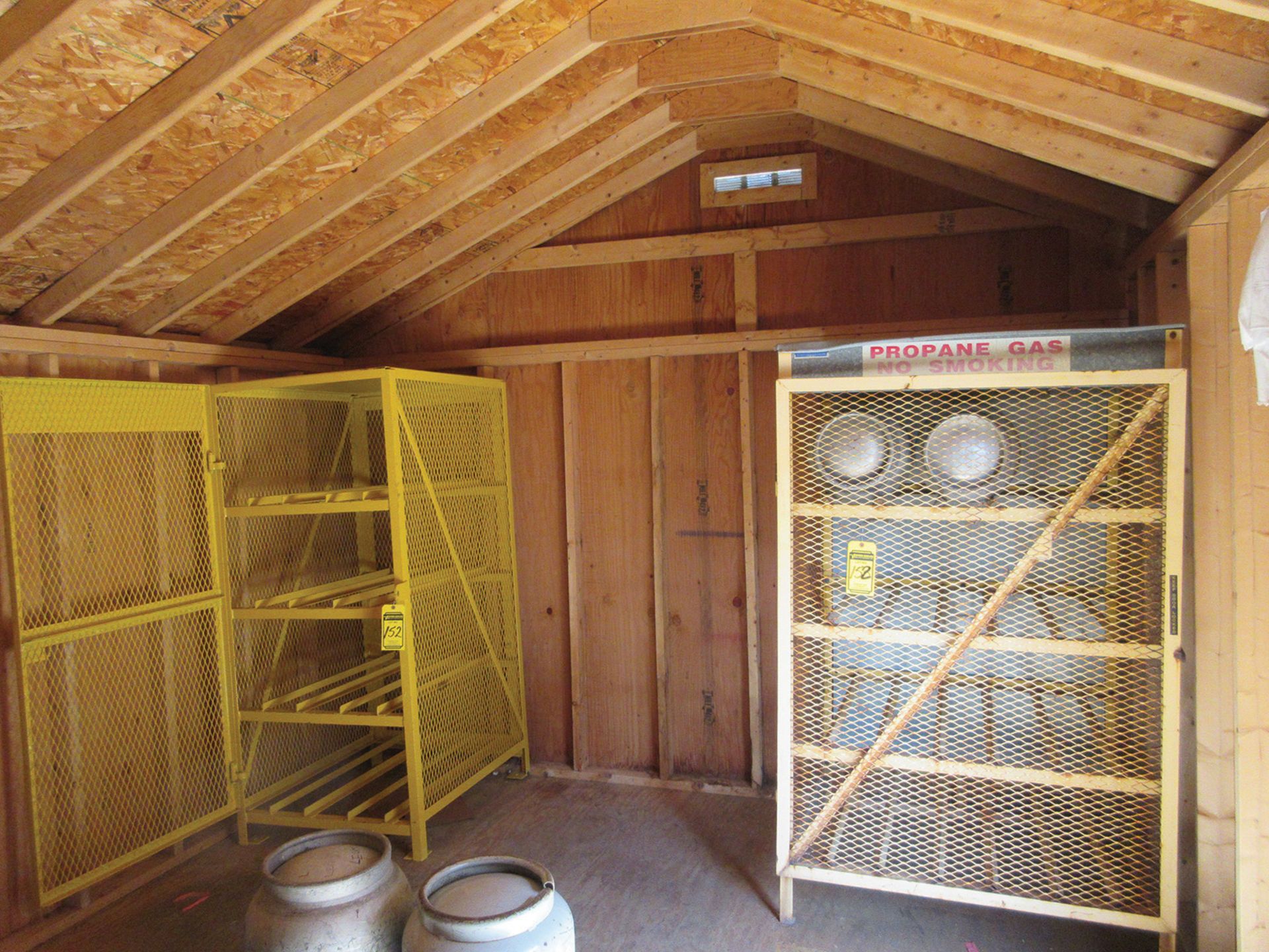 CONTENTS OF SHED; (2) PROPANE STORAGE RACKS, DRAIN SNAKE WITH EXTRA REELS, DOORS, ETC.