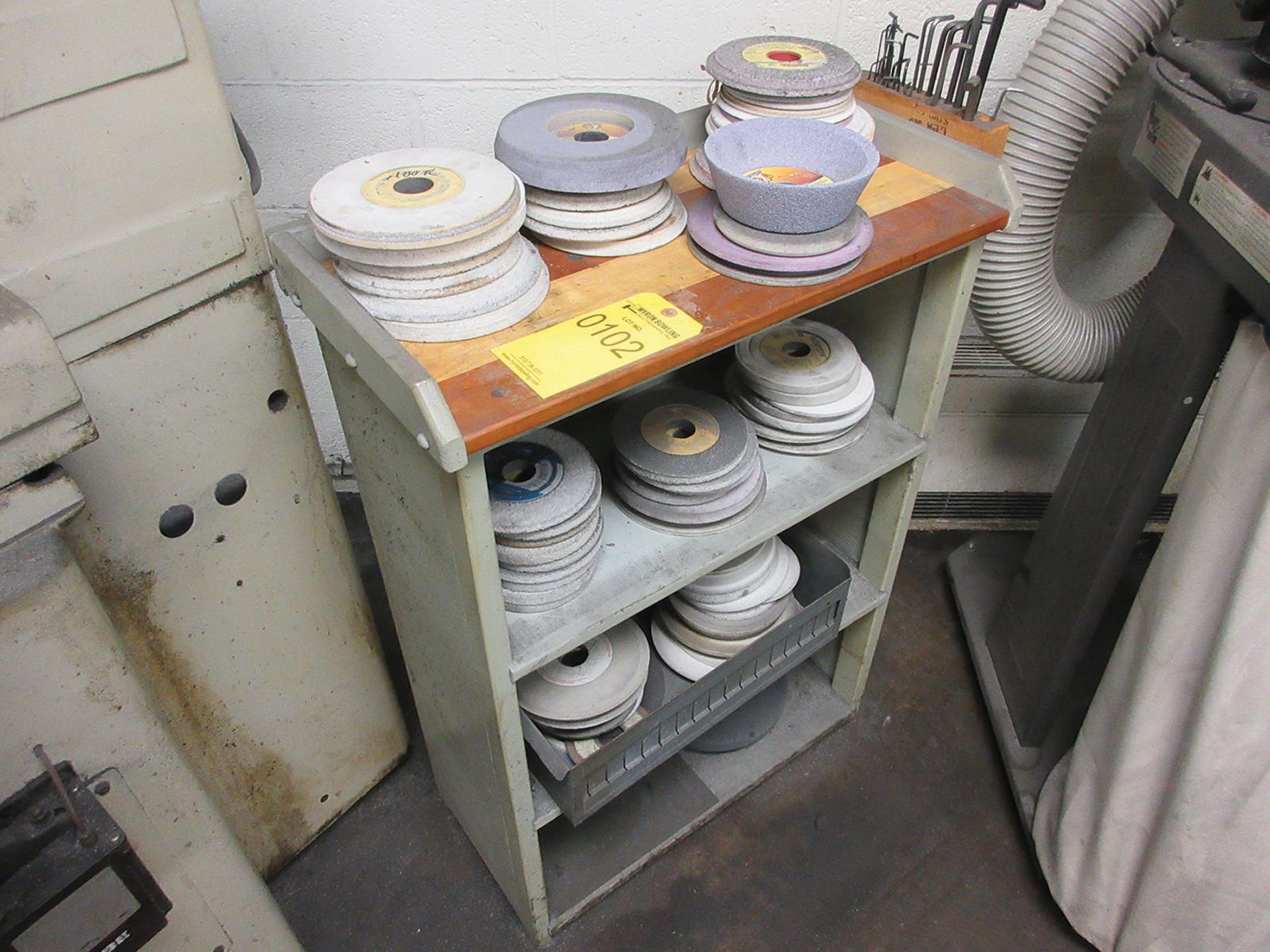 SHELF UNIT WITH ASSORTED GRINDING WHEELS