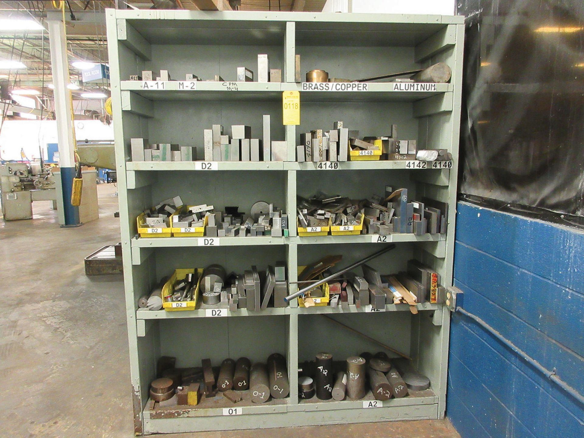 ONE SIDE OF SHELF UNIT WITH ASSORTED TOOL STEEL