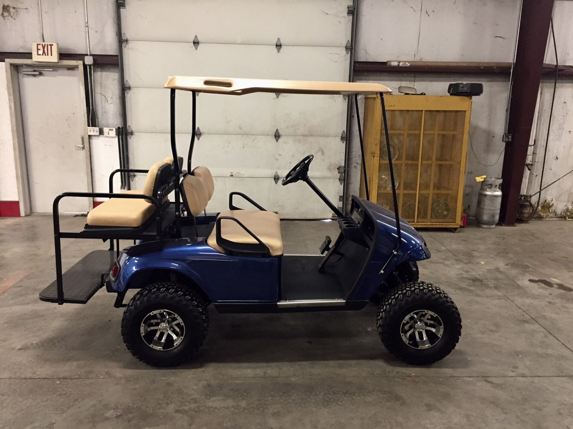 2010 EZGO PDS ELECTRIC GOLF CART, WITH 36 VOLT CHARGER, 4-PASSENGER FOLD DOWN SEAT, LIFT KIT,