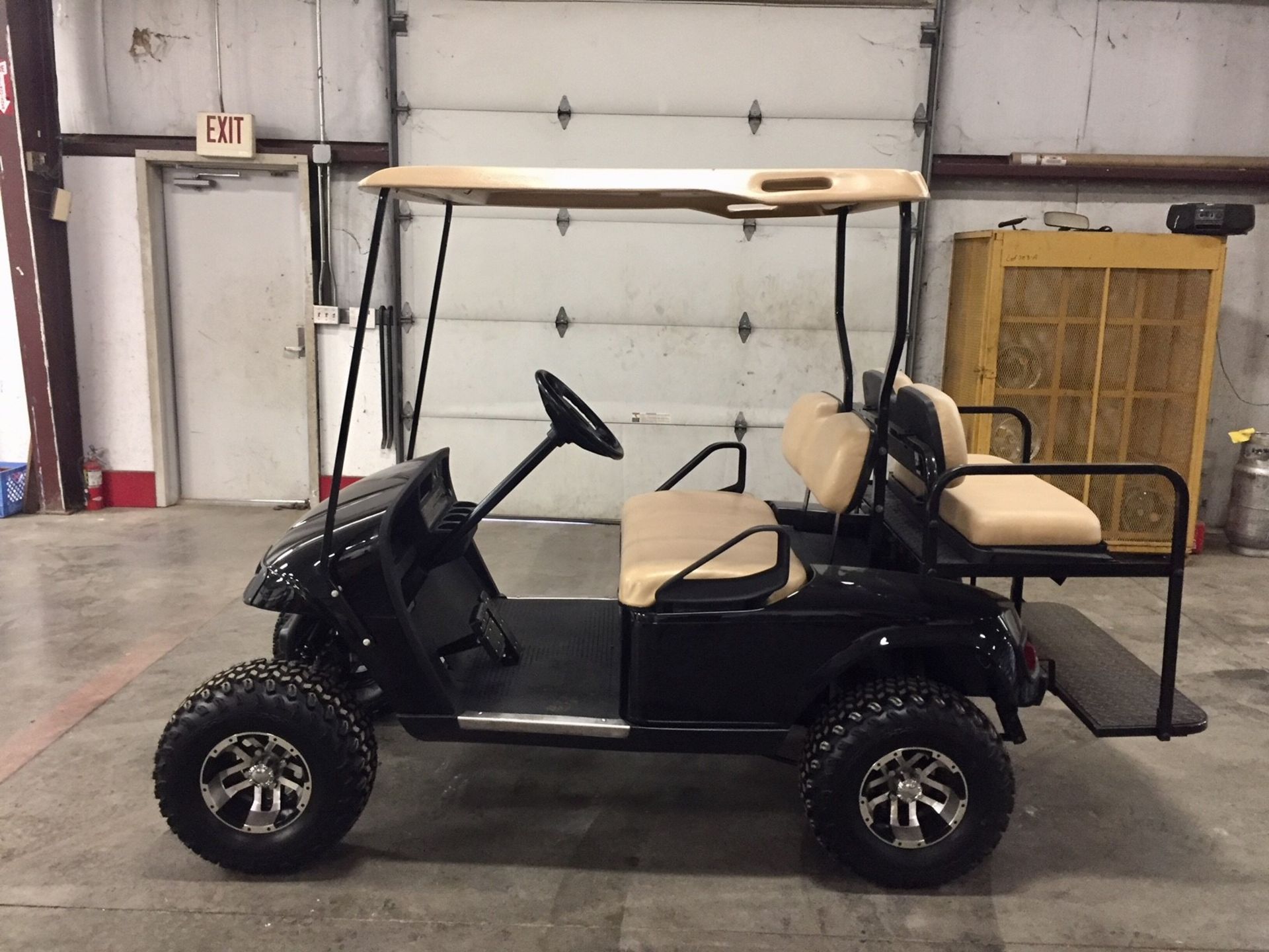 2010 EZGO PDS ELECTRIC GOLF CART, WITH 36 VOLT CHARGER, 4-PASSENGER FOLD DOWN SEAT, LIFT KIT,