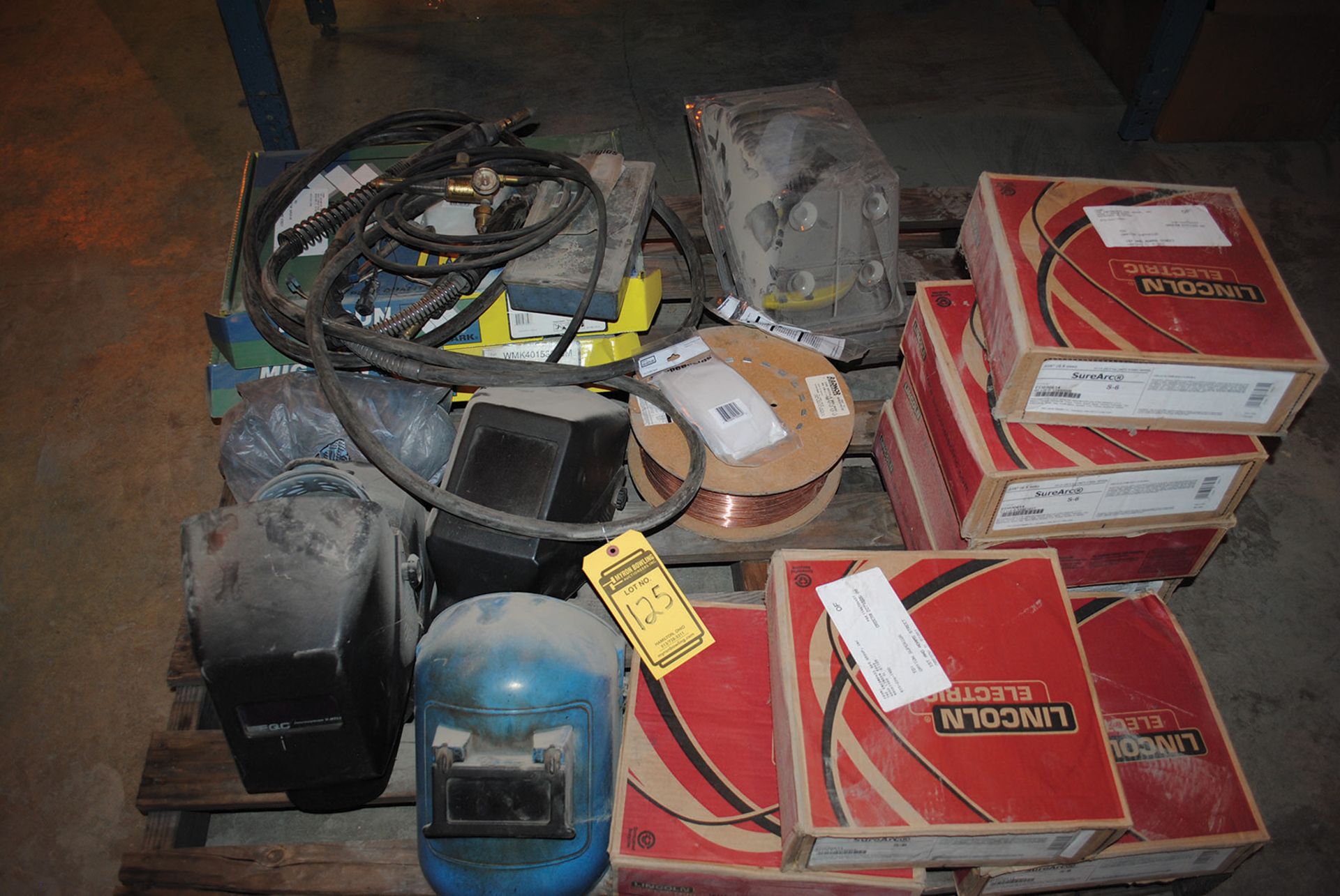 SKID OF ASSORTED WELDING SUPPLIES; WELDING WIRE, HELMETS, AND LEADS