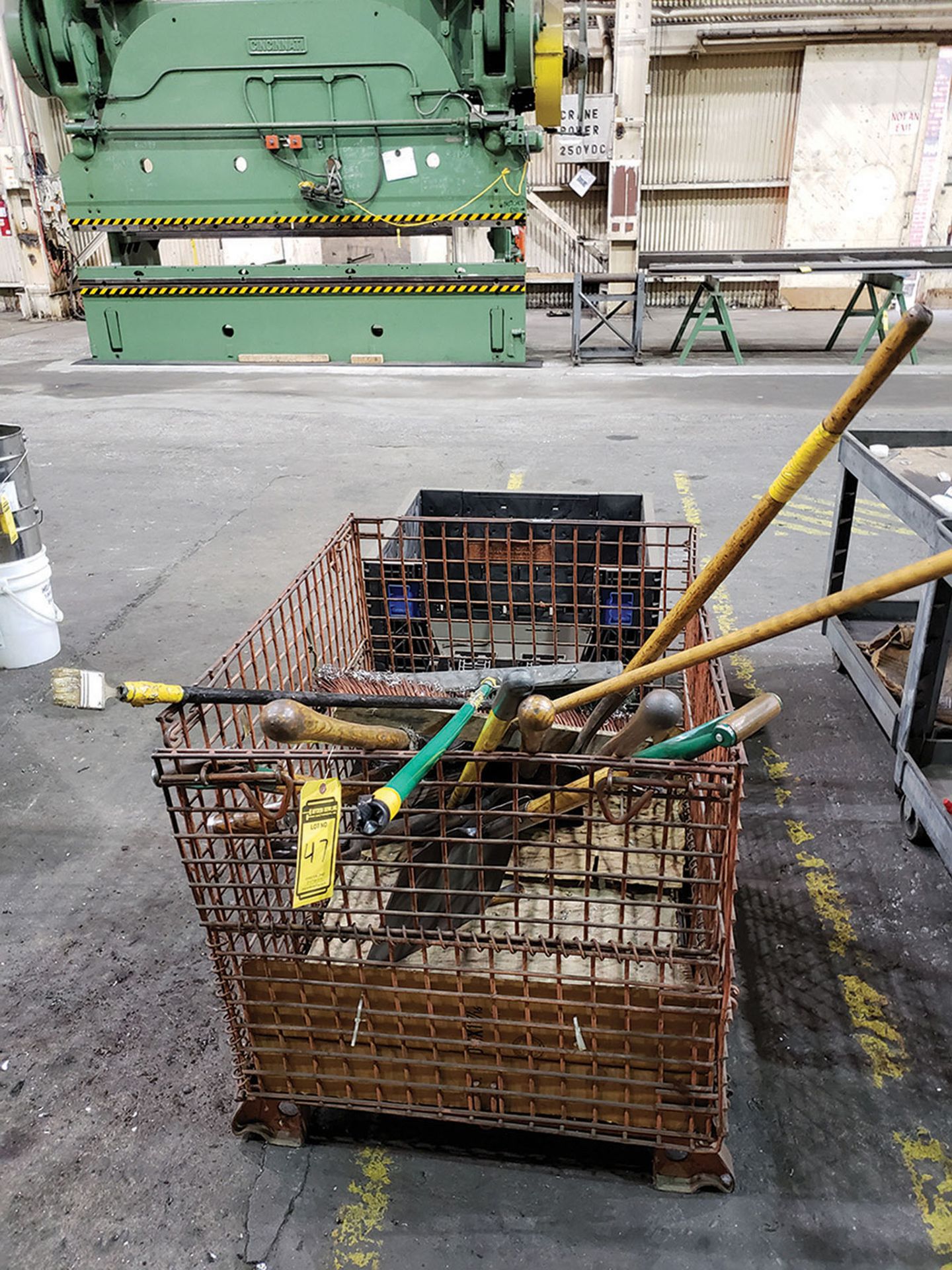 WIRE BASKET WITH SHOVELS, RAKES, AND PLASTIC BIN