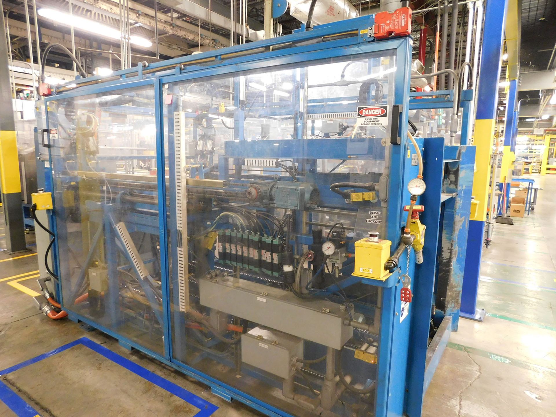 AA DURACELL BLISTER PACK LINE WITH FOLD OVER CASE LOADER MOTORIZED ROLLER CONVEYOR AND ELEVATOR