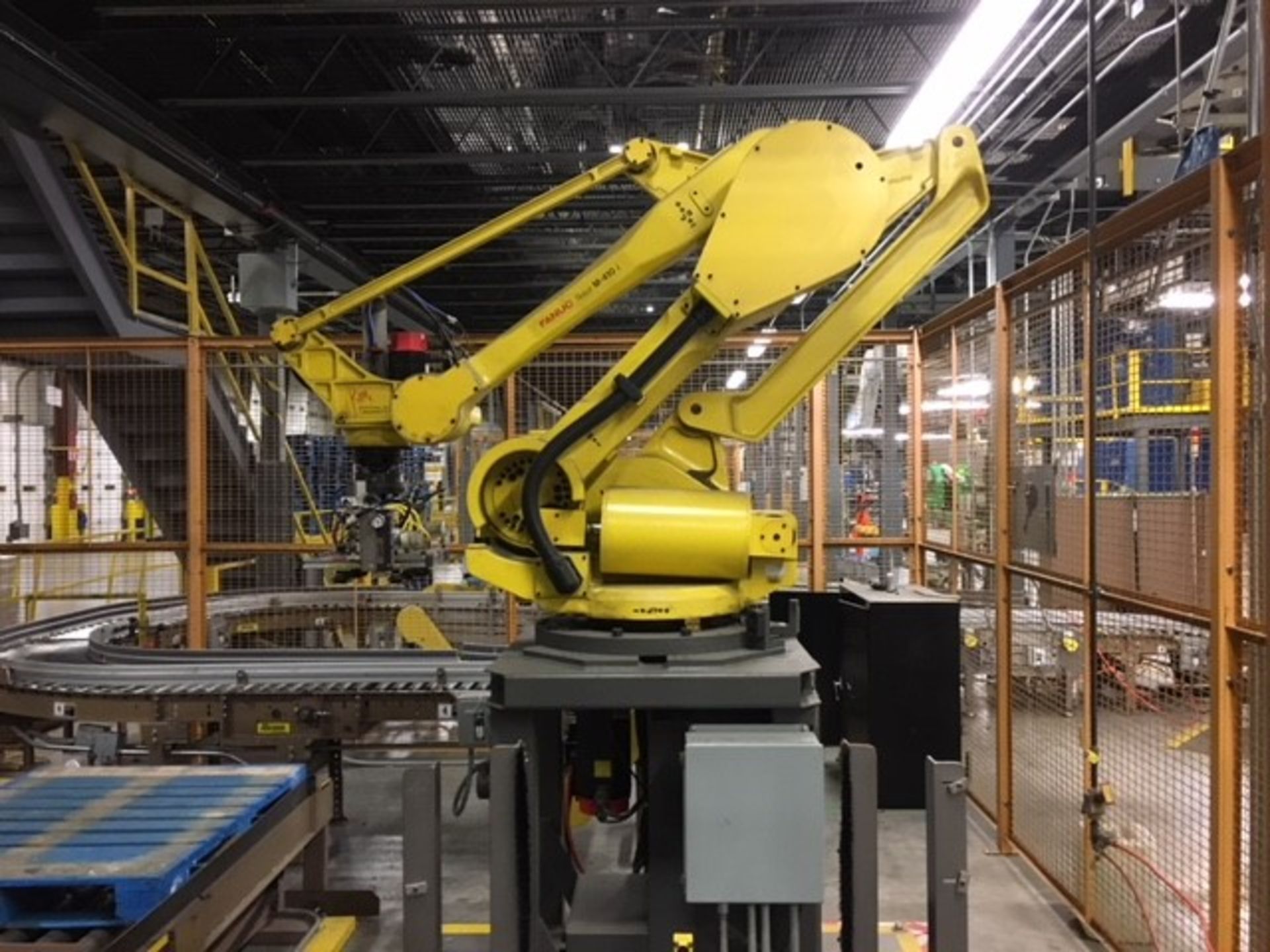 244'' X 224'' WORK CELL CAGE WITH (2) 51'' X 118'' POWER CONVEYORS WITH FANUC M410T ROBOT