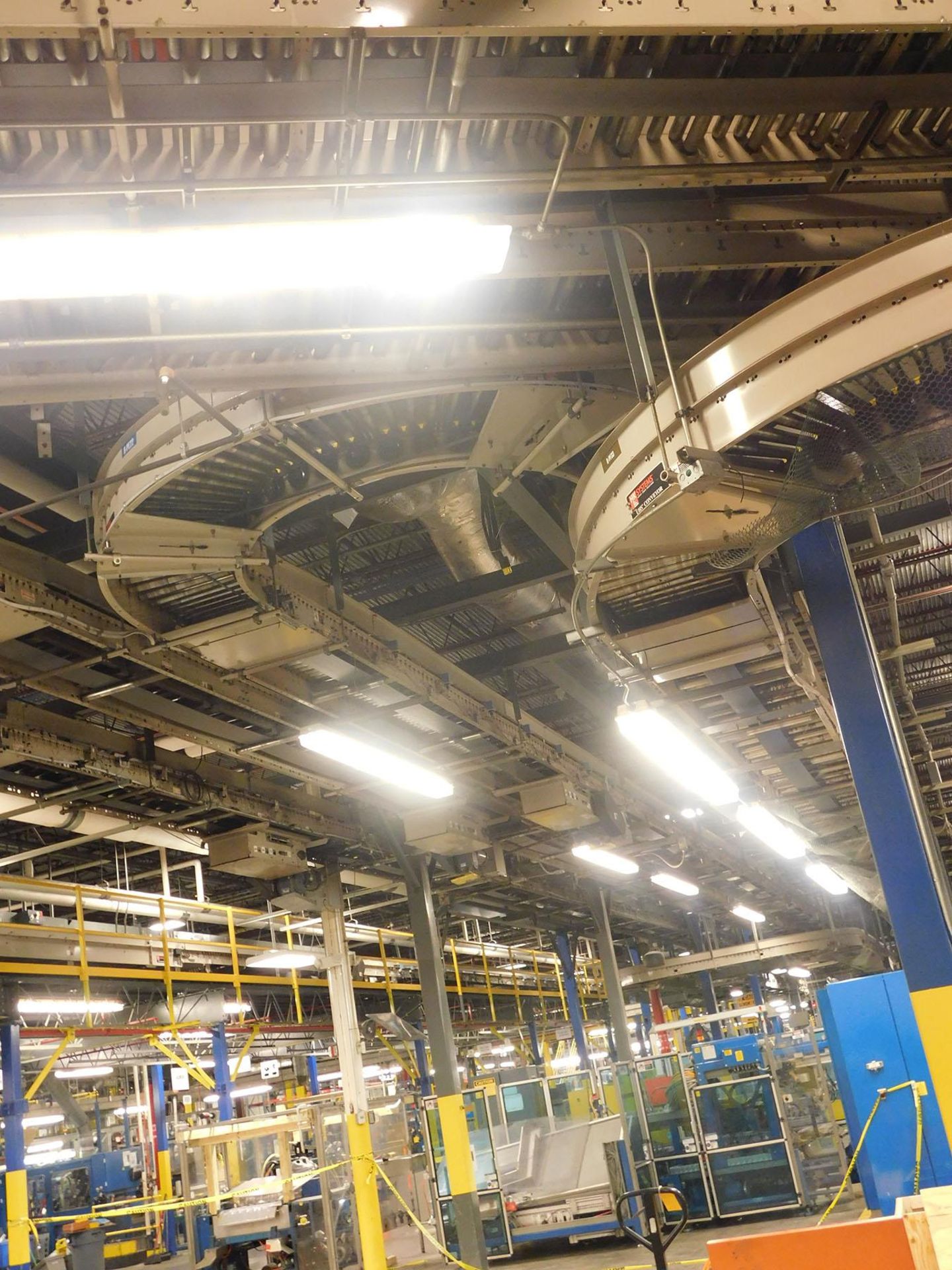 CONVEYOR; DOWN FIRST SECTION OF MIDDLE BAY TO MEZZANINE IN FRONT OF STORAGE CAROUSEL