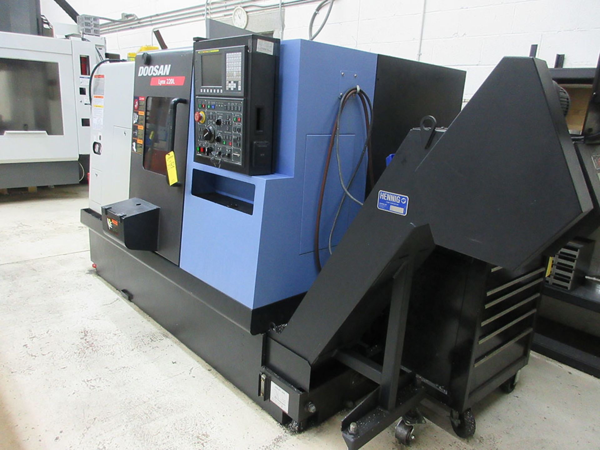 2012 DOOSAN LYNX 220LC CNC TURNING CENTER; TAILSTOCK, CHIP CONVEYOR, FANUC I SERIES CONTROLS, S/N