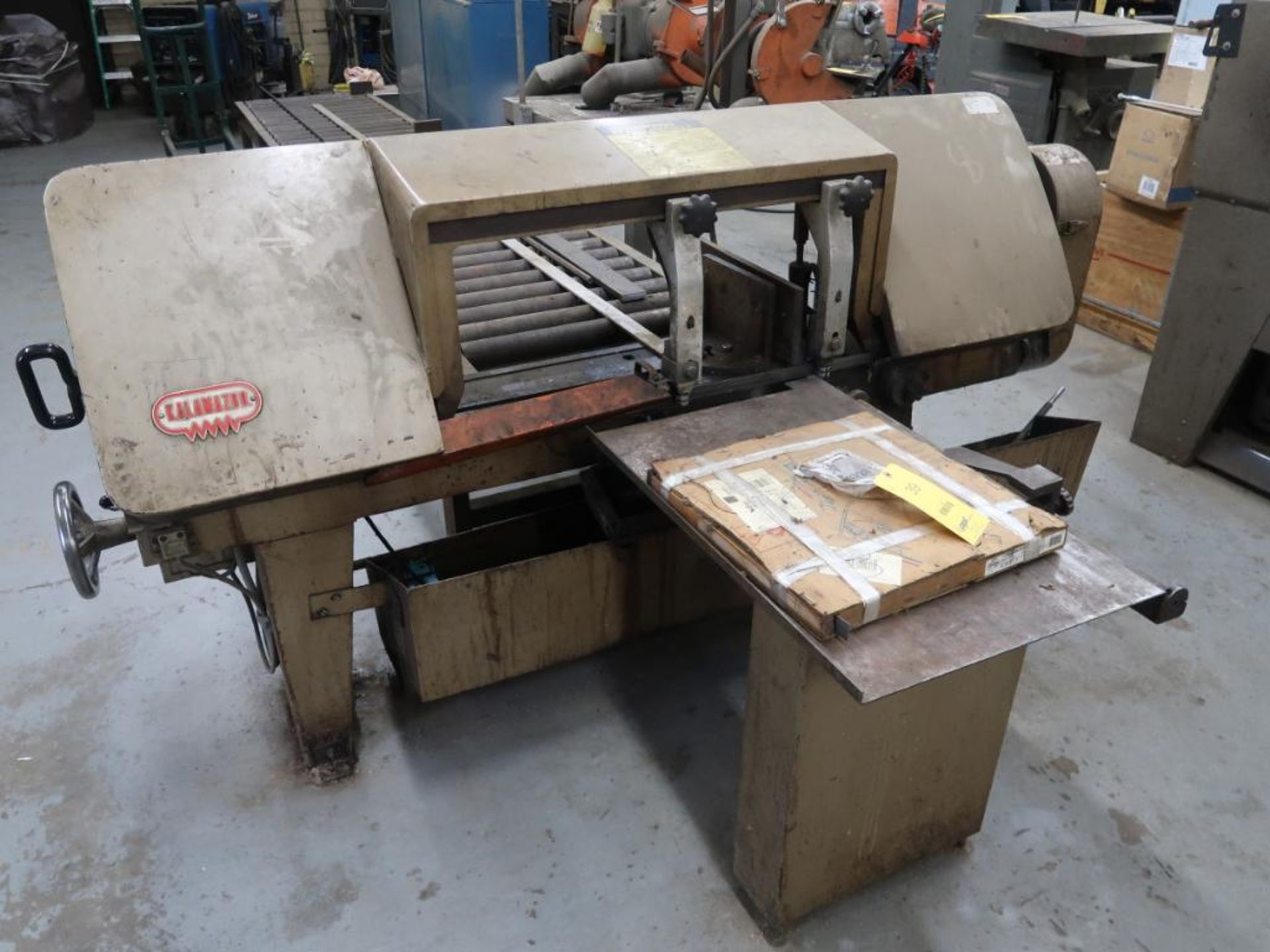 KALAMAZOO Horizontal Band Saw Model 13AWV, S/N 2153, with 15 ft. Roller Conveyor (feed needs repair)