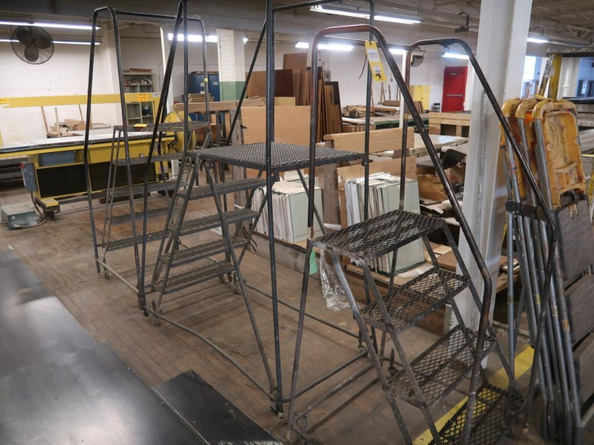 LOT: (3) Rolling Stairways, (1) 6 ft. Ladder, (3) 4-Step Ladders