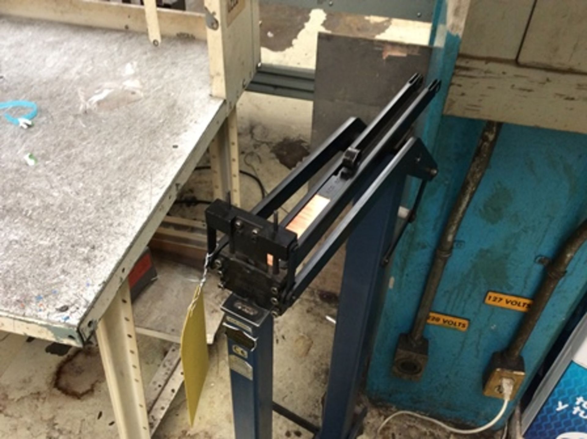 Work table with nylamid cover, 2 Dake manual presses and pedal stapler … - Image 8 of 8