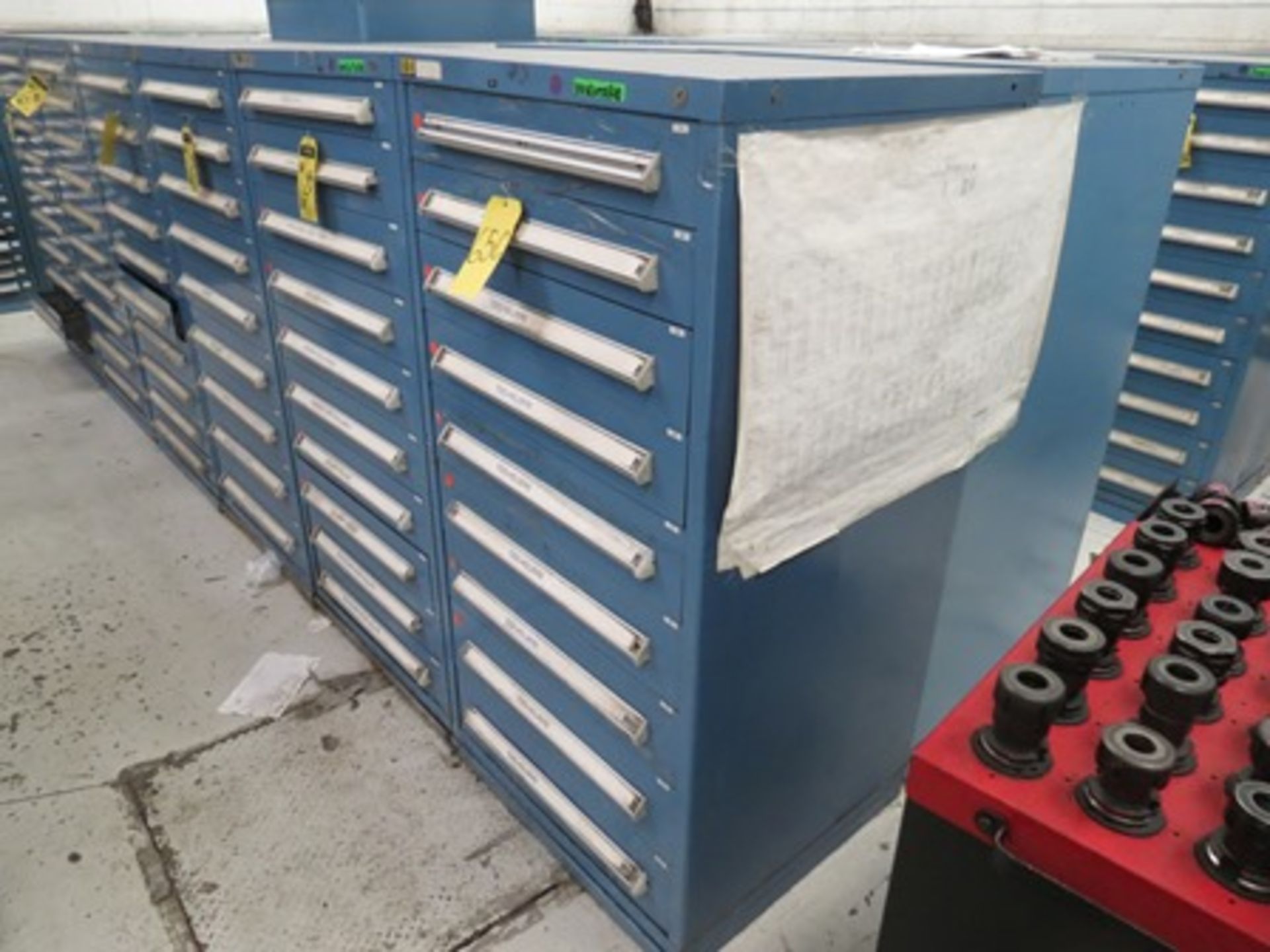 4 tool drawers with 40 drawers in total that contain attachments for turning operations; holder …