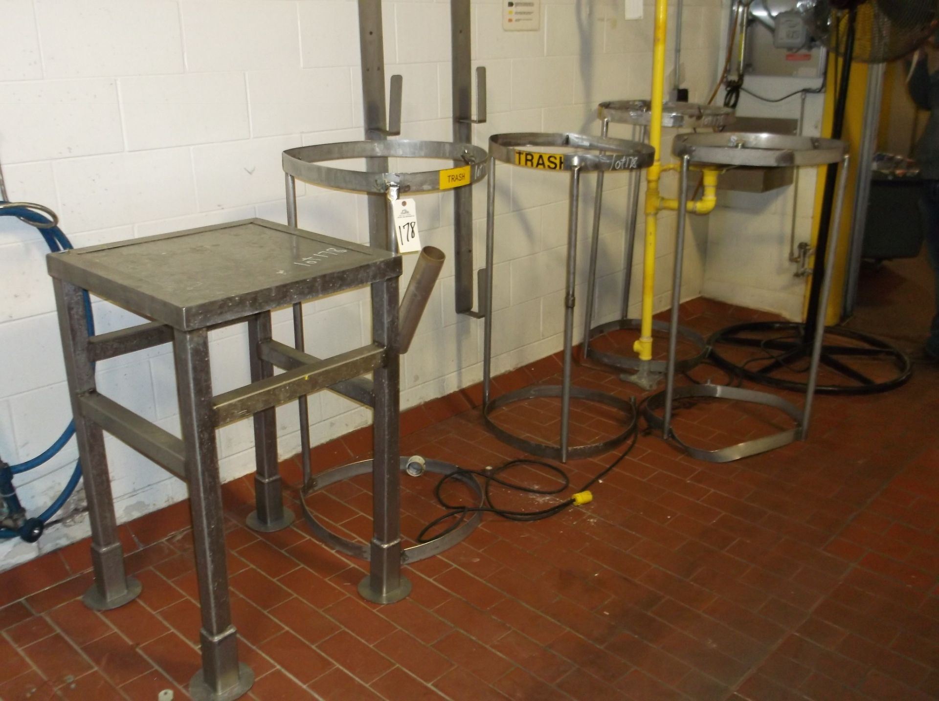 SS table 2ft x 2ft x 3ftH. (3) Garbage bag holders | Rigging/Loading Fee: $100