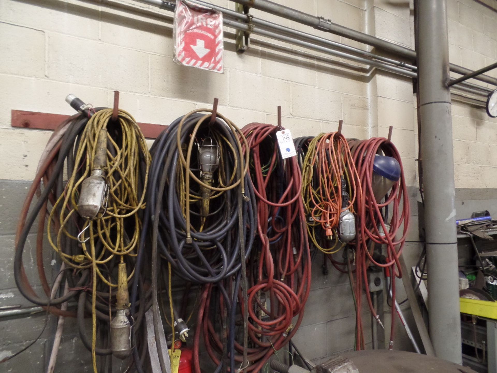 {LOT} Hoses, Extension Cords Lights, Etc. Hanging on wall