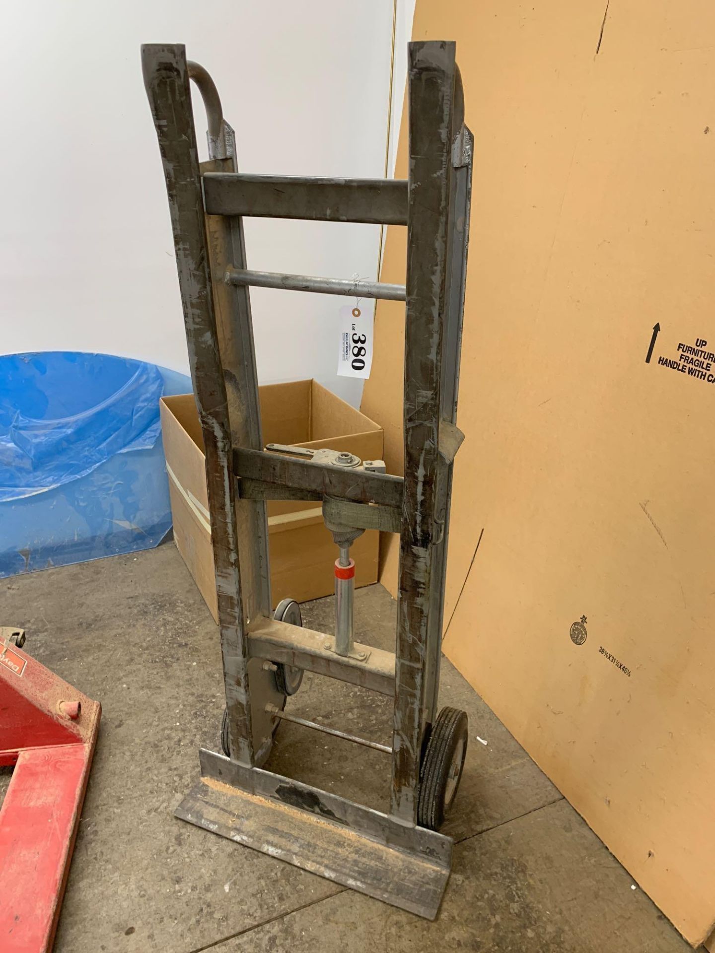 Hand truck and blue rolling step ladder