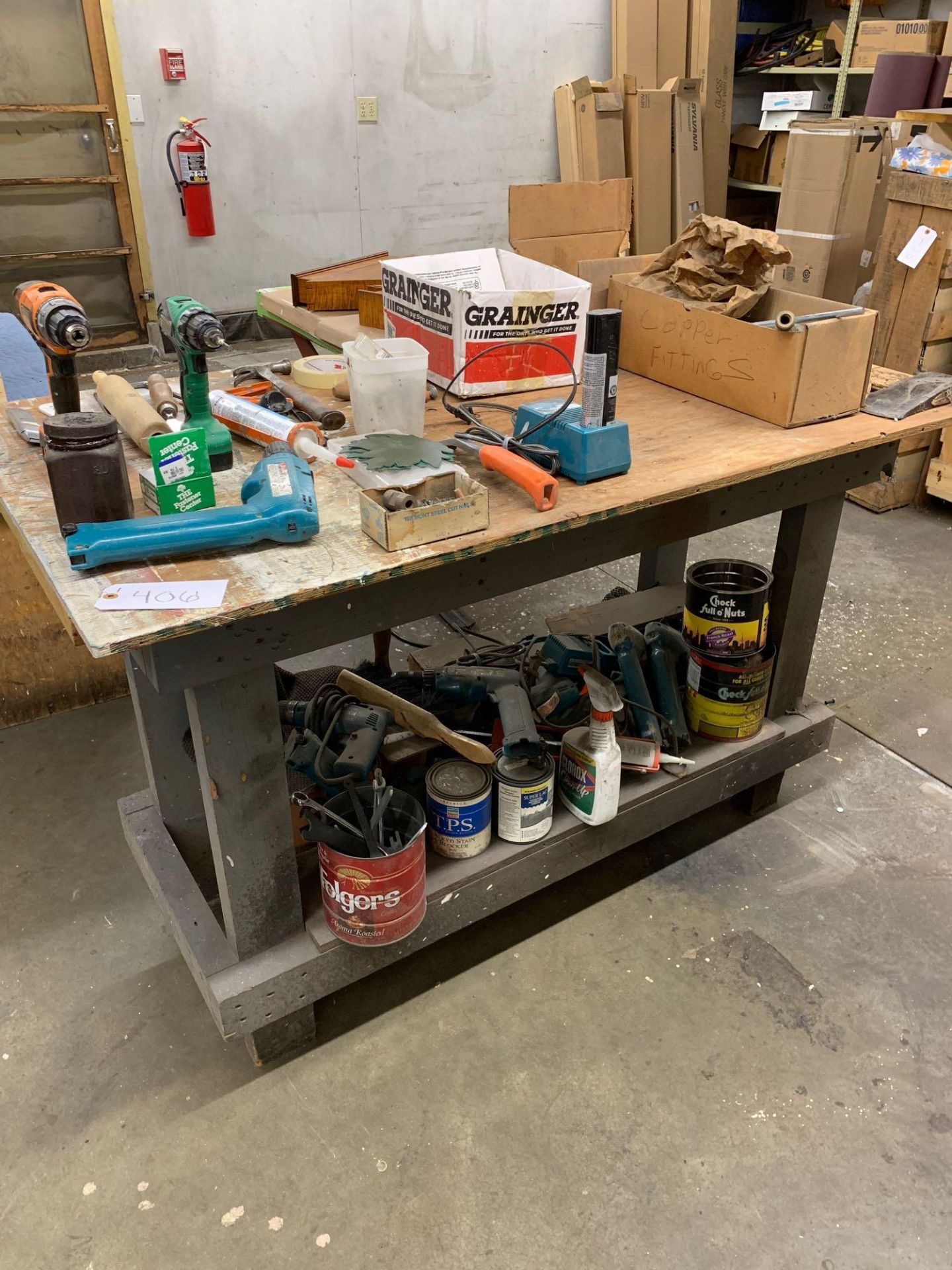 Work bench with misc parts and tools including Makita drills and batteries - Image 2 of 4