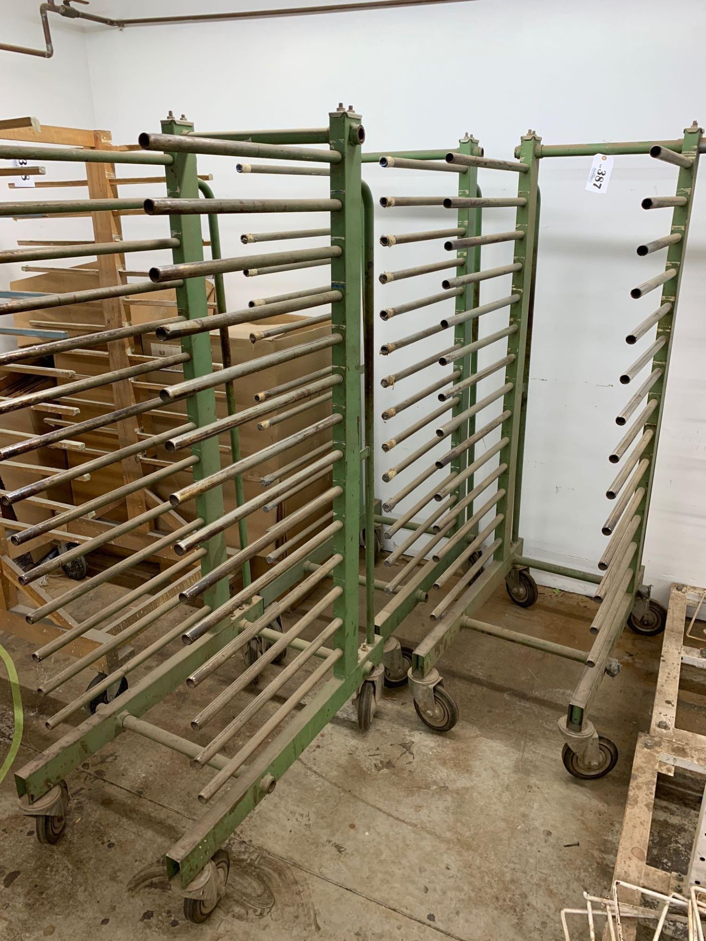 3 green metal rolling drying racks