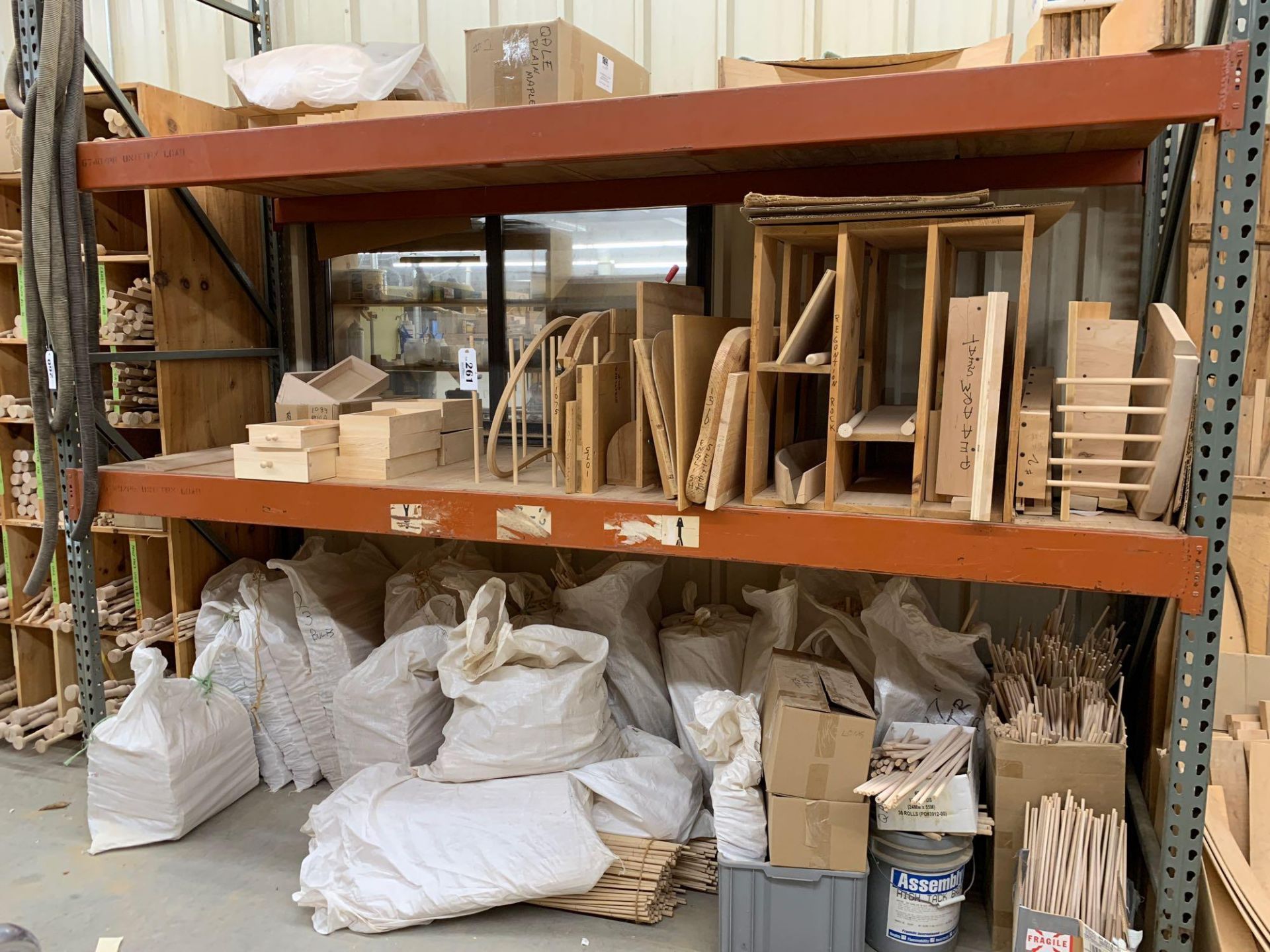 Lot of bagged spindles, dowels and contents of 2 shelves above