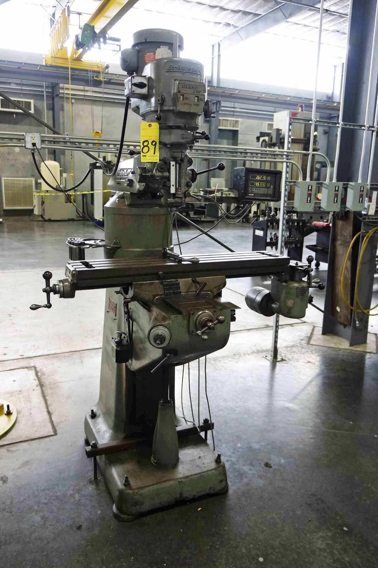 VERTICAL TURRET MILL, BRIDGEPORT, 9" x 42" table, 2 HP motor, riser block, pwr. feed, S/N 194622