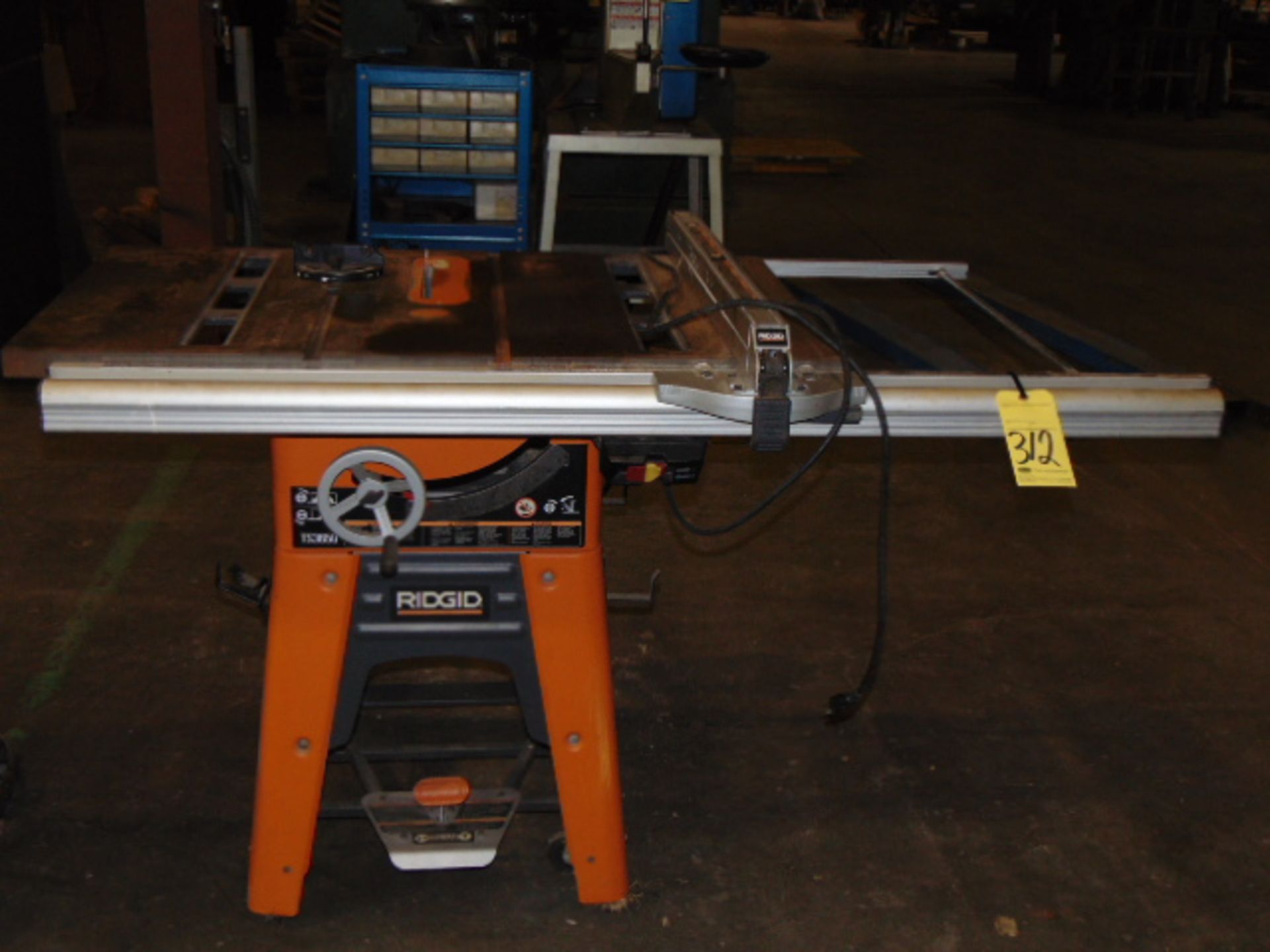 TILTING ARBOR TABLE SAW, RIDGID MDL. TS3650, roller stand, extended rip fence