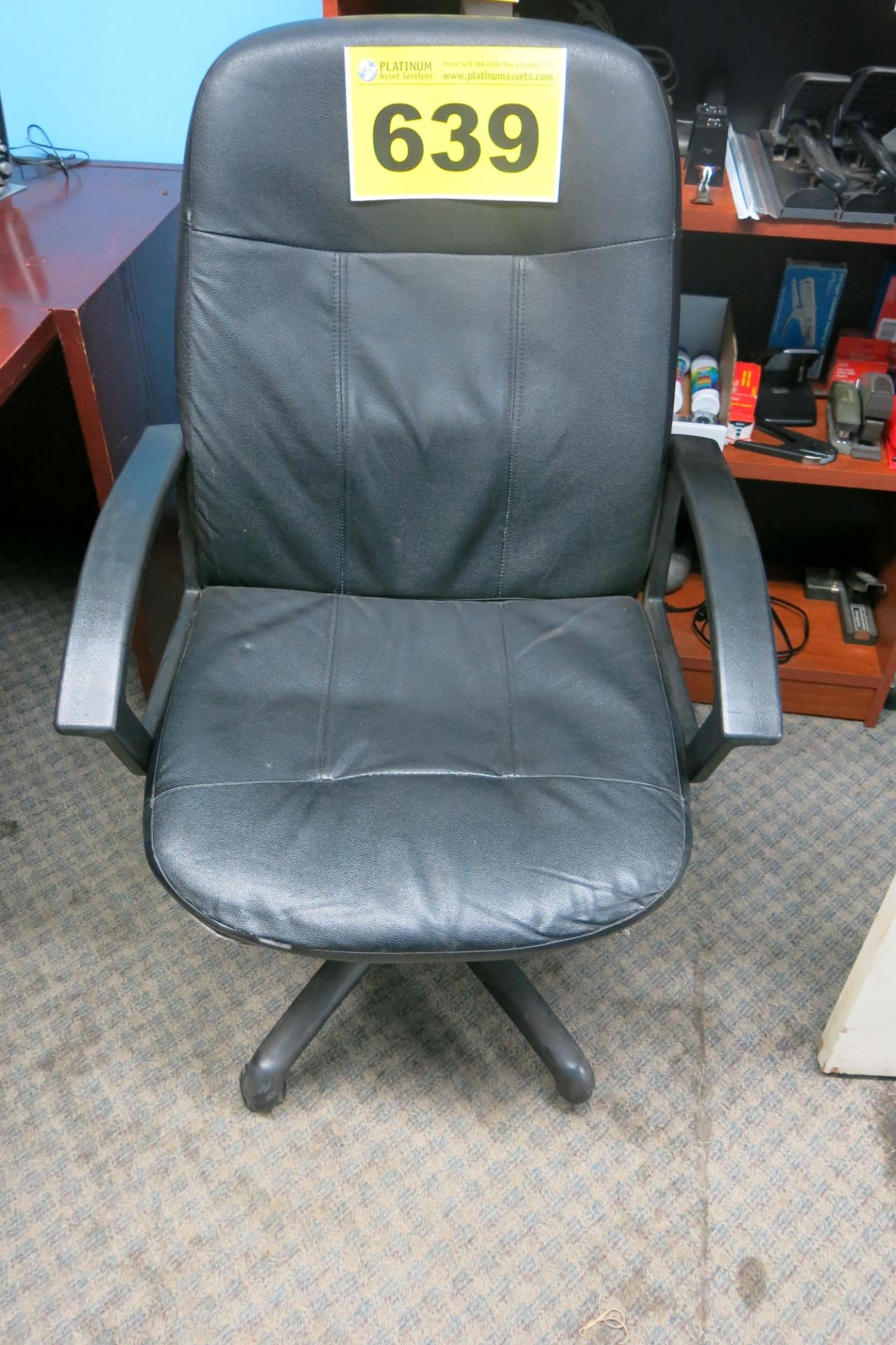 LEATHER CHAIR ON CASTERS (LOCATED IN MISSISSAUGA)