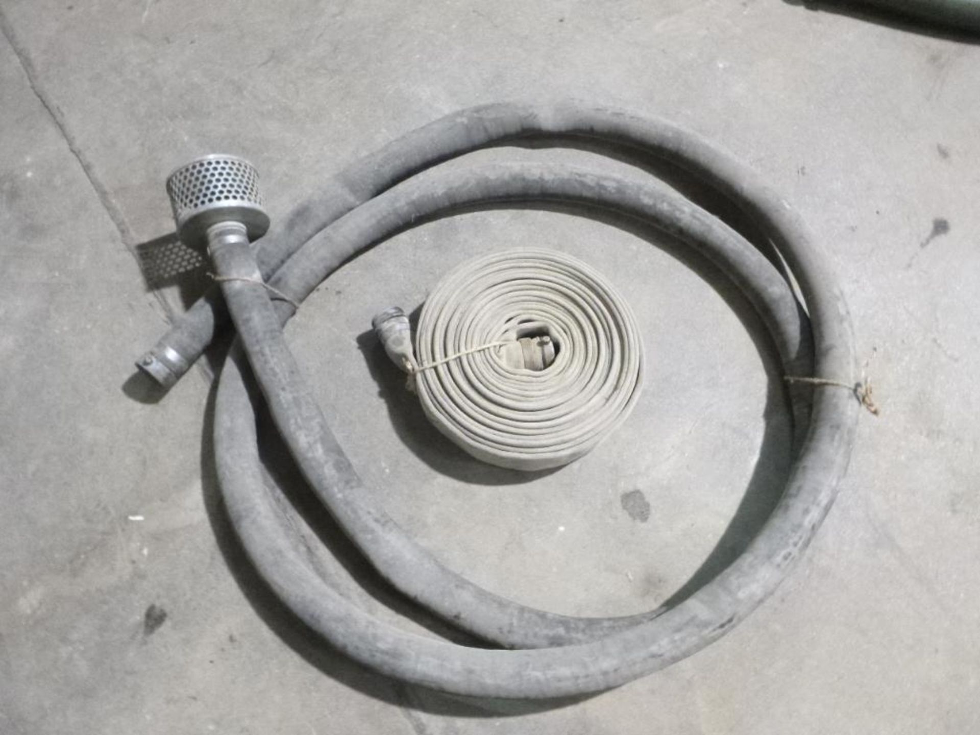 LOT: (1) 2 in. Intake Hose, (1) 2 in. Discharge Hose