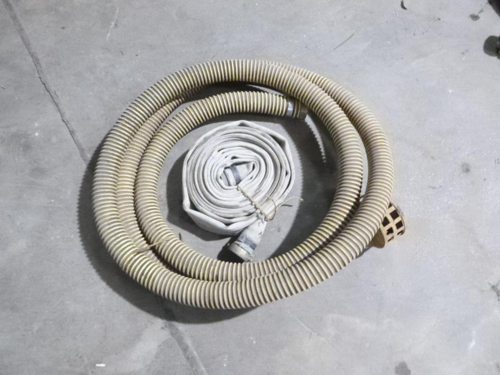 LOT: (1) 2 in. Intake Hose, (1) 2 in. Discharge Hose