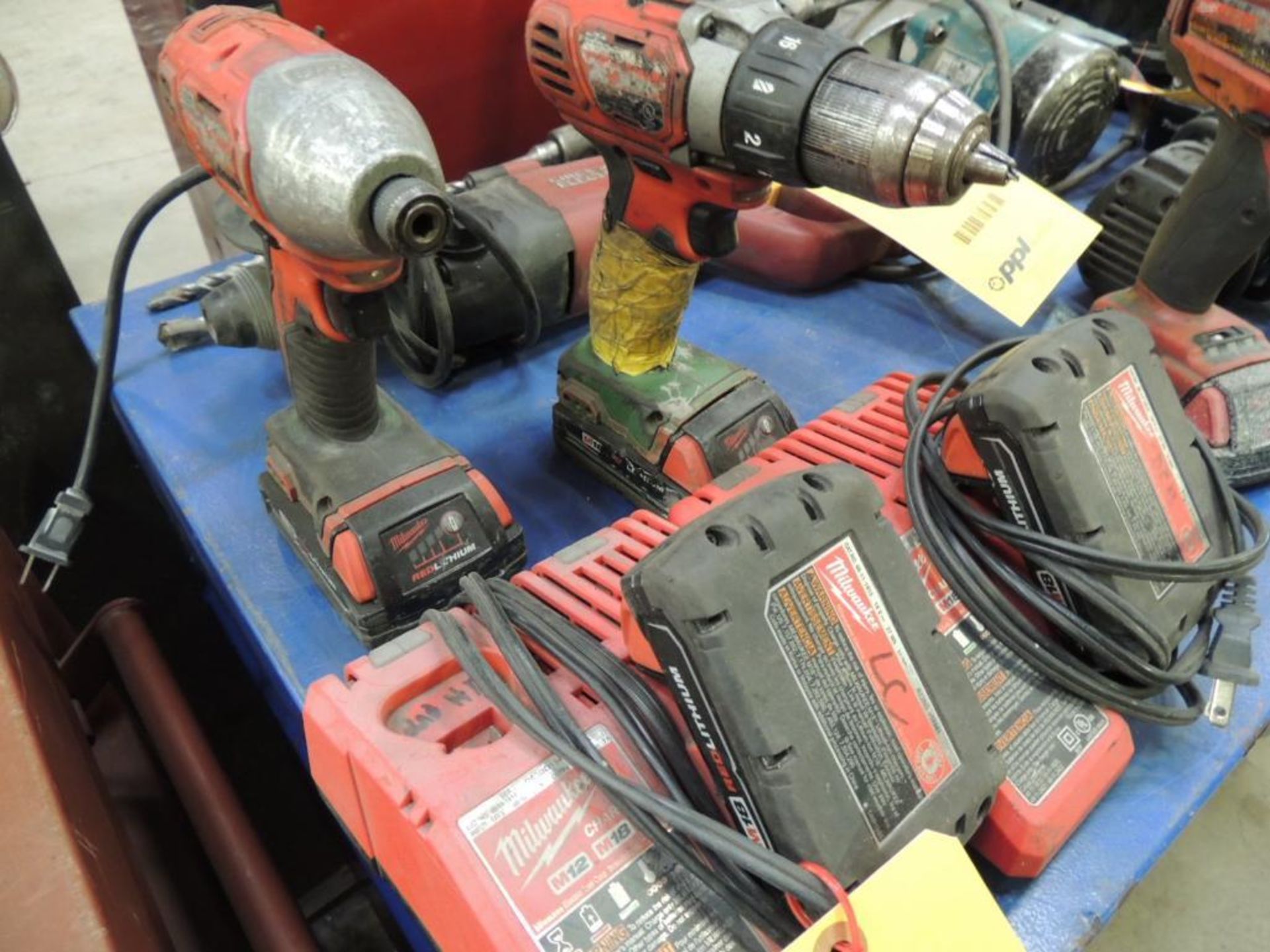 LOT: (2) Milwaukee 1/4 in. Impacts, 3/8 in. Drill, with Chargers, 18 Volt