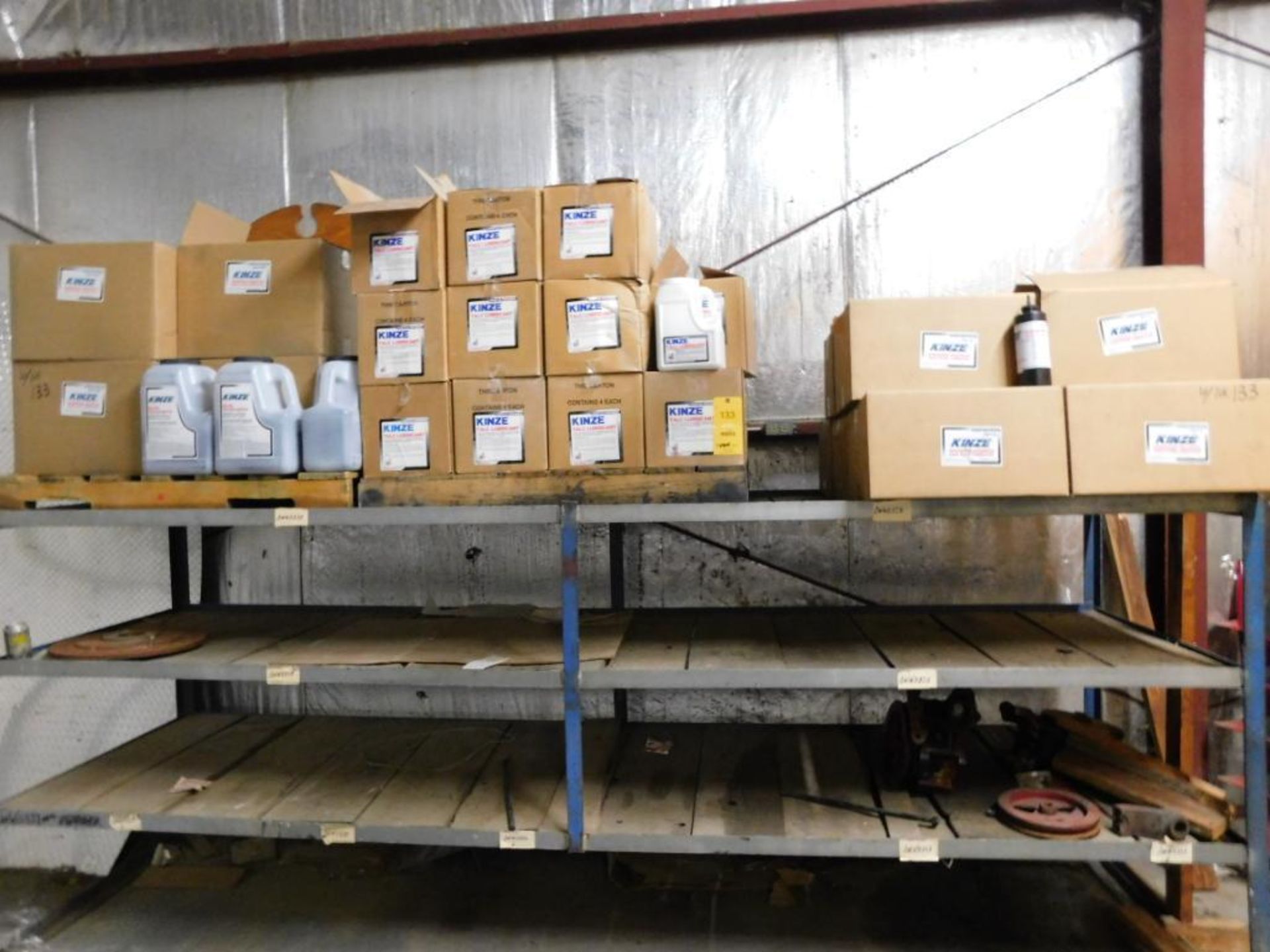 LOT: Rack with Approx. (25) Cases Kinze Talc & Graphite Seed Flow Lubricant