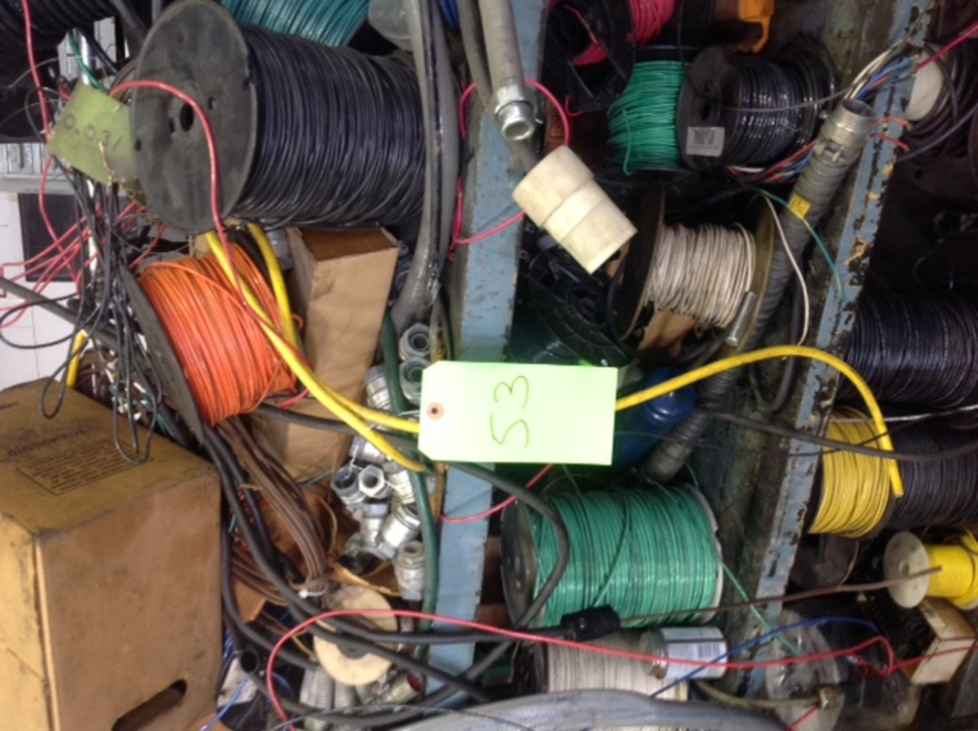 Lot of wire spools on rolling cart