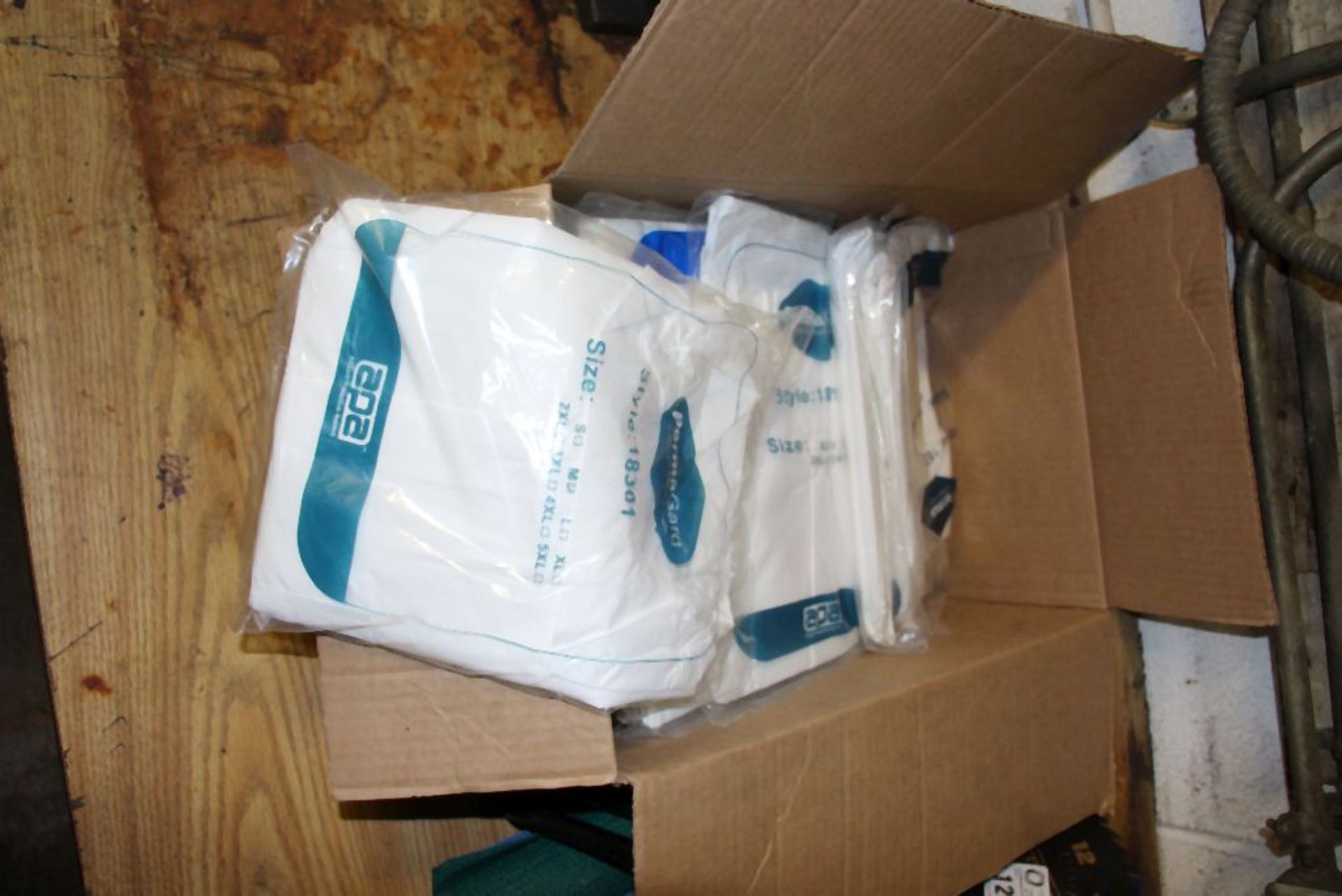 case of paper coveralls, assorted sizes