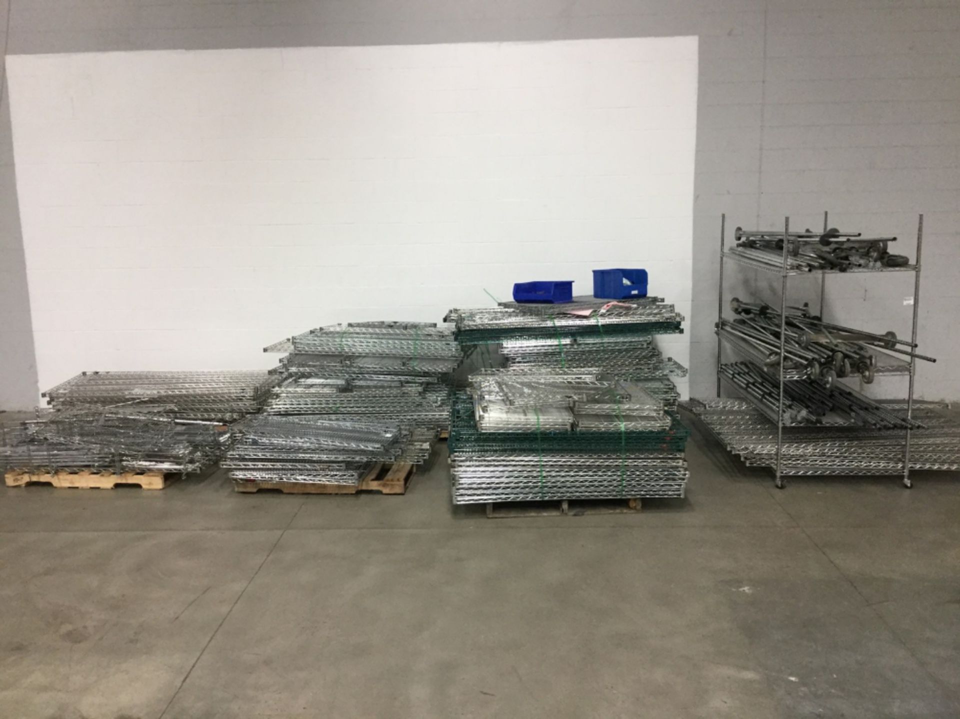 (6) Pallets and (1) Rack of Miscellaneous Metro Rack Parts