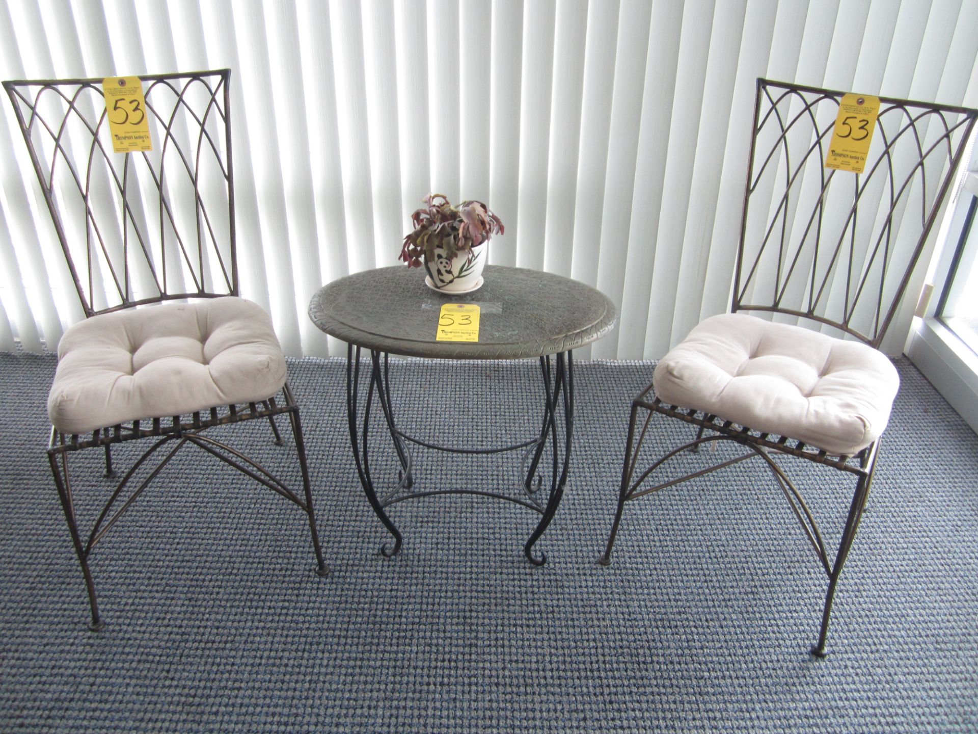 Wrought Iron Table with (2) Wrought Iron Chairs and Cushions