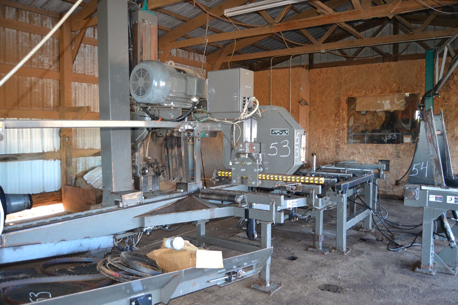 WOOD MIZER LT300 BAND MILL W/ LOG TRUNER W/ 20' SLAB BELT W/ 30HP MOTOR W/ COMPUTER CONTROLS