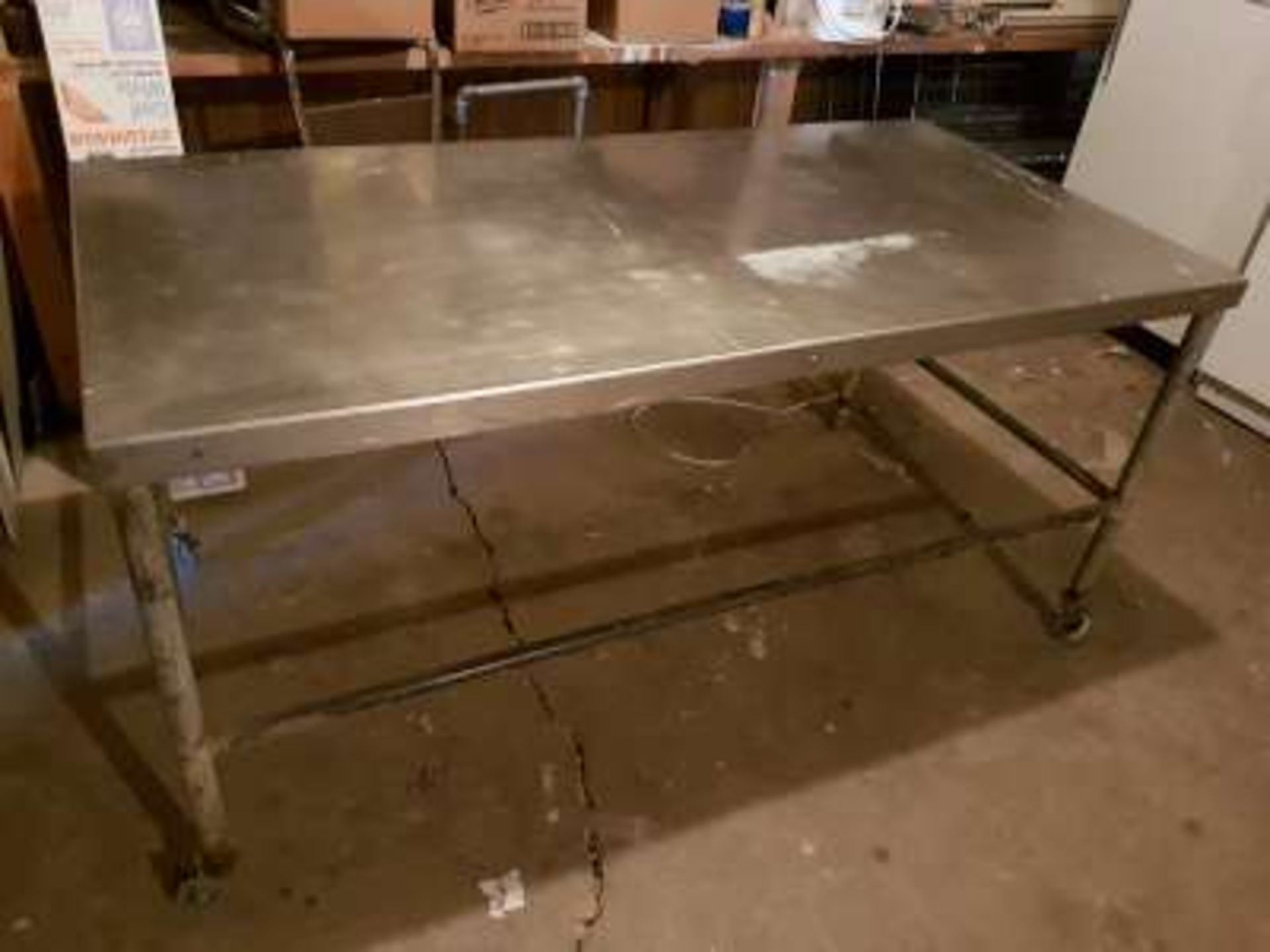 Stainless steel table on wheels (6ftx3ftx34in)