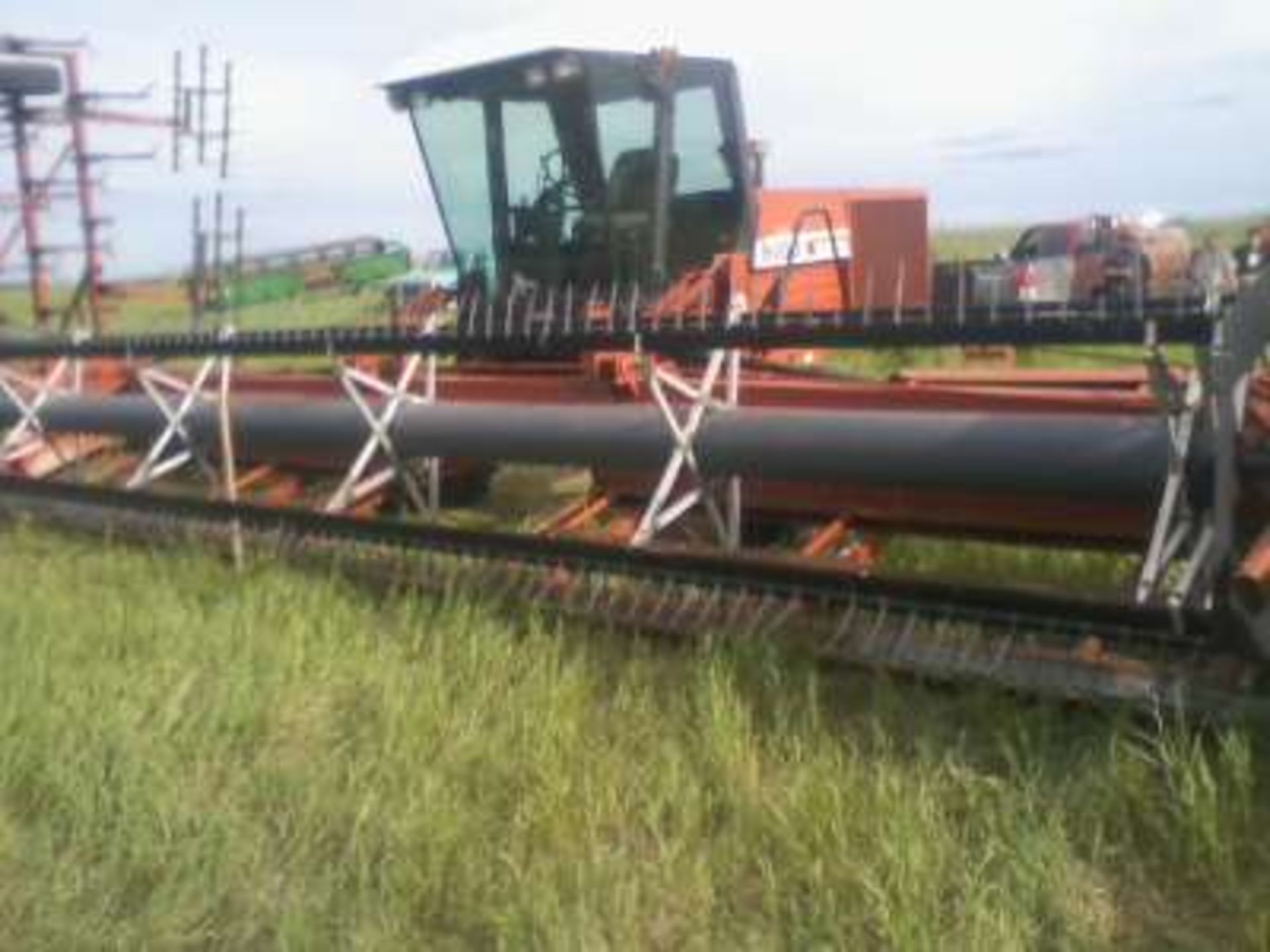 8100 Hesston swather s/n 810T01210, 1898 hrs, 30ft header, p/u reels, dbl knife, dbl swath,