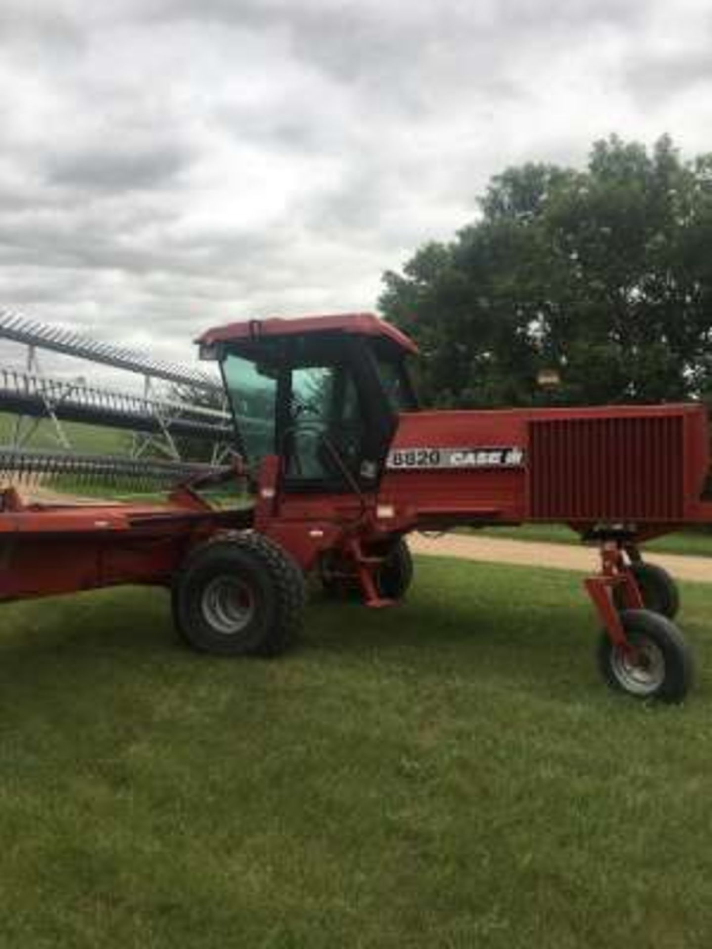 1997 Case IH #8820 S.P. swather, cab, 25ft table (shifting), PU reels, tires good, 1910 hrs (nice