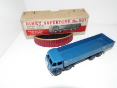 Dinky Supertoys - a Foden Diesel 8-wheel wagon # 501 dark blue, cab, body, chassis and ridged hubs,