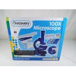 A Discovery Channel 100x microscope entitled Explore the World of Science,