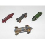 Four early 20th century metal diecast model racing cars, playworn,