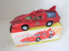 Dinky Toys - a Spectrum Patrol car # 103, metallic red body, blue tinted windows, yellow interior,