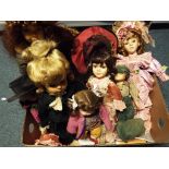 A collection of eleven porcelain dressed dolls on stands - This lot MUST be paid for and collected,