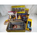 A box of G scale scenics to include street lamps, figures, telephone boxes,