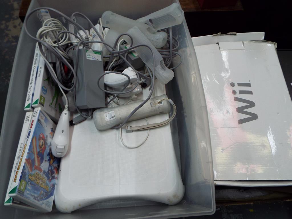 Nintendo Wii - a Nintendo Wii computer gaming console with Wii balance board,