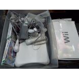 Nintendo Wii - a Nintendo Wii computer gaming console with Wii balance board,