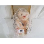 Steiff - a mohair Steiff teddy bear girl tennis player with button, original tags,