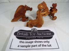 Unused Retail Stock - a good collection of wooden push along toys,
