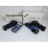 Franklin Mint - four diecast model motor vehicles to include a 1933 Duesenberg J Franklin Mint 1:18