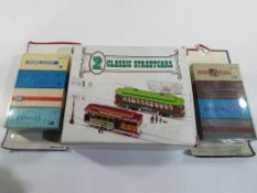 Two classic street cars, boxed and two blister packs by Jouet Haulage Freight Containers.