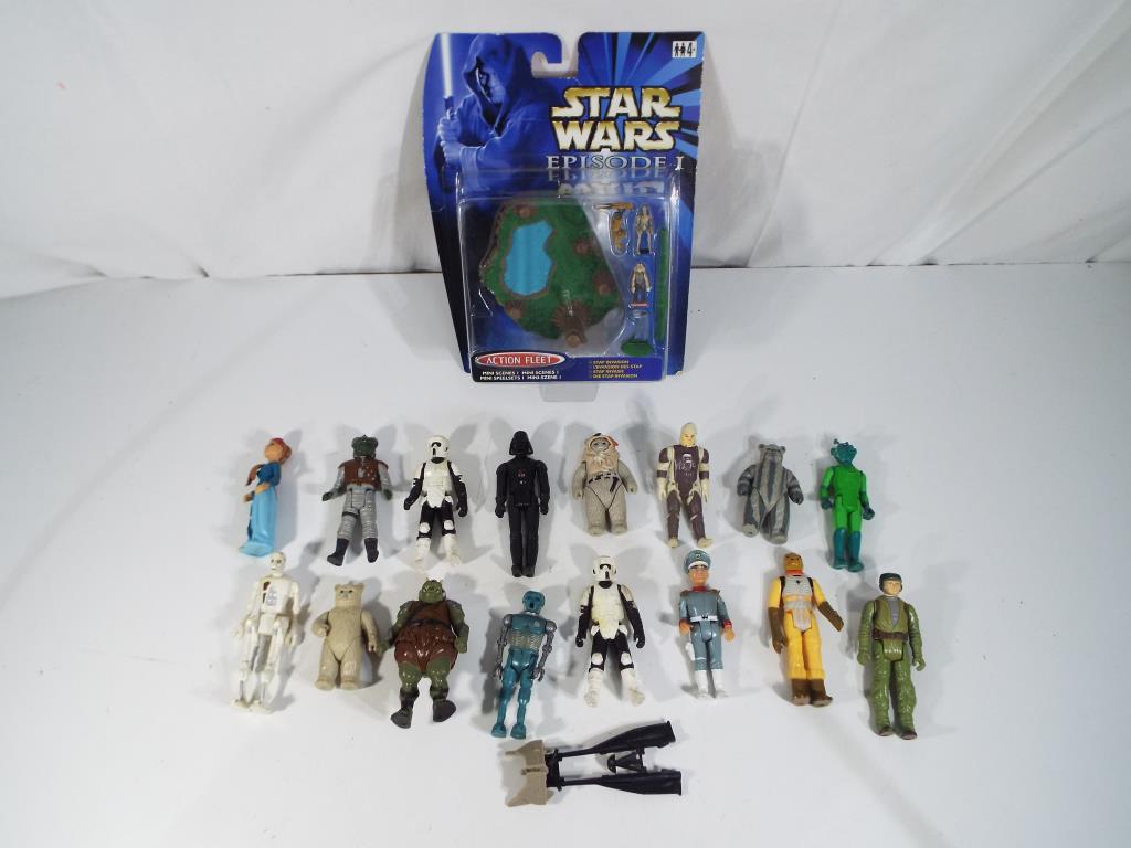 Star Wars - twelve unboxed Star Wars character action figures to include Darth Vadar, Ewoks,