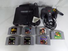 Nintendo - an unboxed Nintendo 64 game console with one controller and seven unboxed game